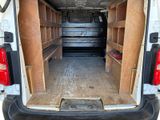 a white van that has some shelves in the back of it