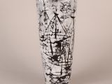 a black and white picture of a vase with a ship on it