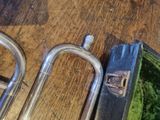 a trumpet and a case on a wooden table