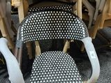 many chairs that are stacked on top of each other
