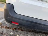 a close up of the rear end of a white car