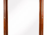 an antique mirror with a wooden frame and gold trimmings