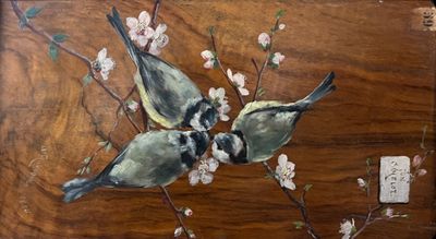 two birds sitting on a branch of a cherry tree