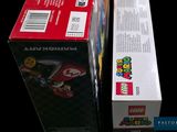 two boxes of nintendo wii games sitting next to each other