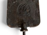 an image of an old cast iron tool on a white background
