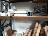 a wooden shelf with various items on it in a room