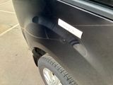 a close up of a car door handle with a sticker on it