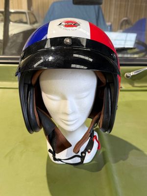 a helmet on a mannequin head on a table