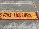 an image of a yellow and red sign that says us fins liqueurs
