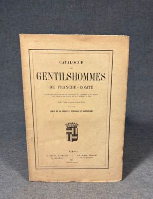 a close up of a book on a table with a gray background