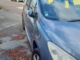 a blue car that is parked in a parking lot