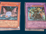 two cards that are sitting next to each other on a table