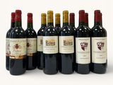 six bottles of wine are lined up in a row on a white surface