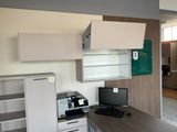 a desk with a computer and a printer on it