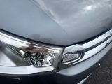 a close up of a car ' s headlight and front bumper