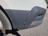 a close up of a car ' s door handle and tire