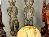 three figurines sitting next to each other on a table