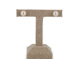 the letter t is made out of burlock with pearls on it