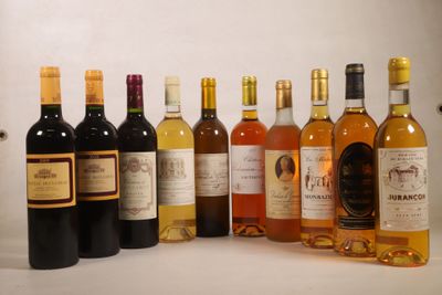 several bottles of wine are lined up in a row on a table