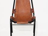 a brown leather chair with a black frame and black legs