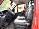 a red van with black seats and a steering wheel