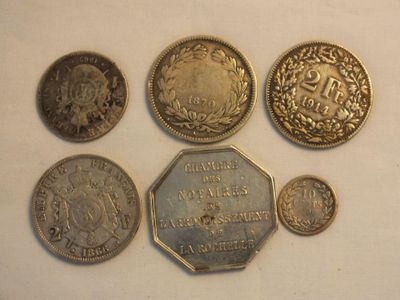 a lot of coins that are sitting on a table