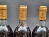 three bottles of wine sitting next to each other on a table