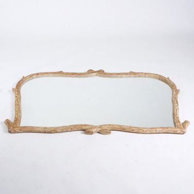 an antique gold mirror with a wooden frame and a white background