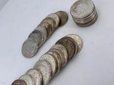 a pile of coins sitting on top of a white table