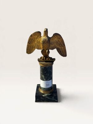 a statue of an eagle on top of a pillar