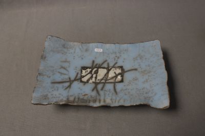 a blue plate with a picture of a bird on it