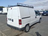 a white van that is parked in a parking lot
