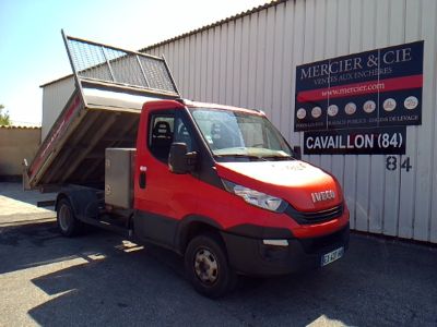 a red truck that is parked in front of a building
