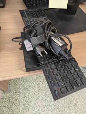 a keyboard and a mouse on a desk next to each other