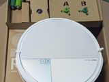a white robot that is sitting in a box
