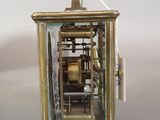 a small clock that is sitting on a table