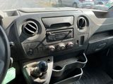 a dashboard of a car with a steering control