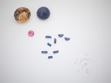 the contents of a jewelry making kit on a white surface
