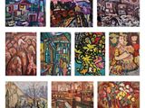 Plusieurs tableaux, de couleurs et de tailles variées, sont exposés sur une surface blanche.