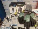 several pairs of gloves, gloves, gloves, gloves, and other items on a table