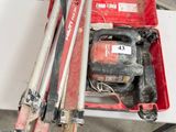 a red tool box with tools in it sitting on a table