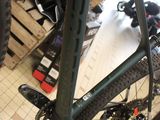 a bike that is parked in a room with other bikes
