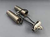 a pair of silver exhaust pipes on a gray surface
