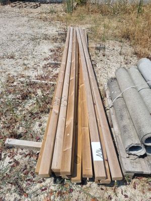 several pieces of wood are stacked on top of each other in a field