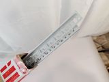 a box with a knife sticking out of it on a bed