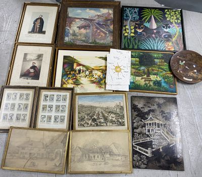 a lot of framed pictures on the floor of this room