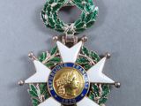 an image of a medal with a red ribbon around it