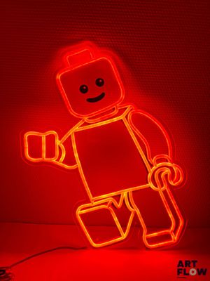 Enseigne lumineuse « Lego Man » sur fond rouge
