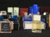 a lot of perfume bottles that are sitting on a table