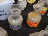 many different types of bottles and containers on the table